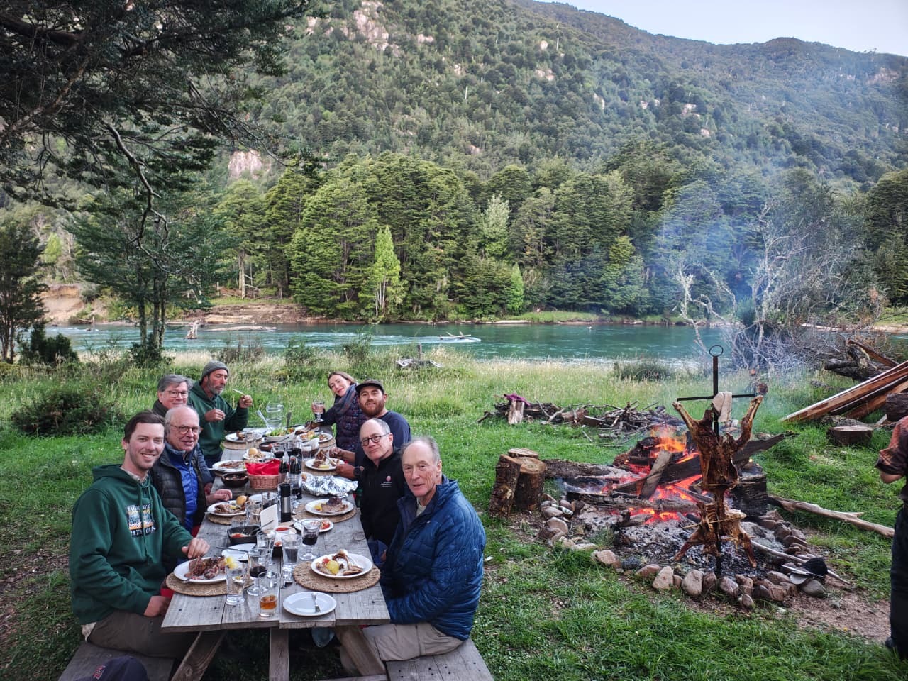 Asado at River of Dreams Basecamp — dinner by the Río Blanco after a day on the water